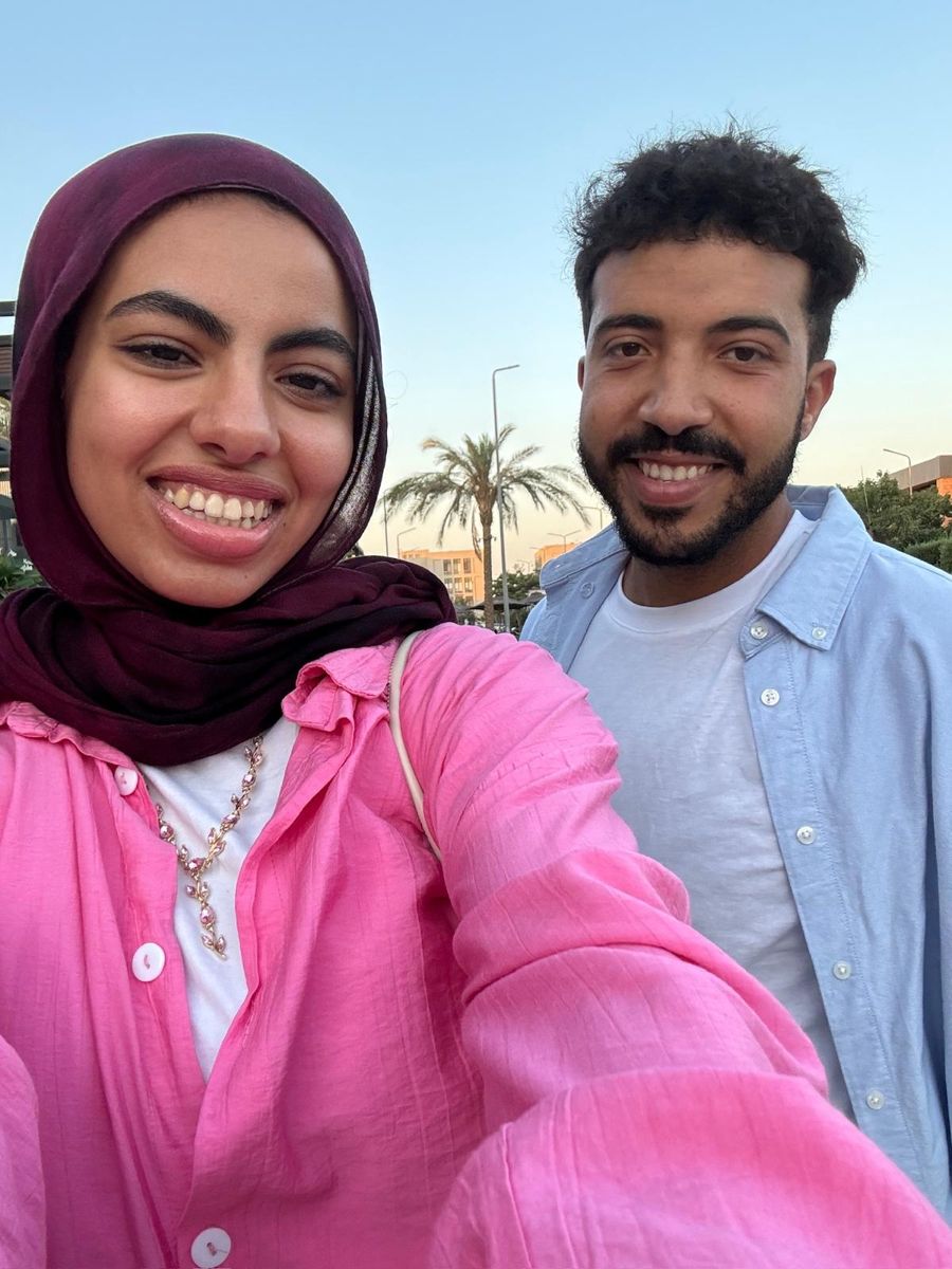 Selfie of us outside with a palm tree